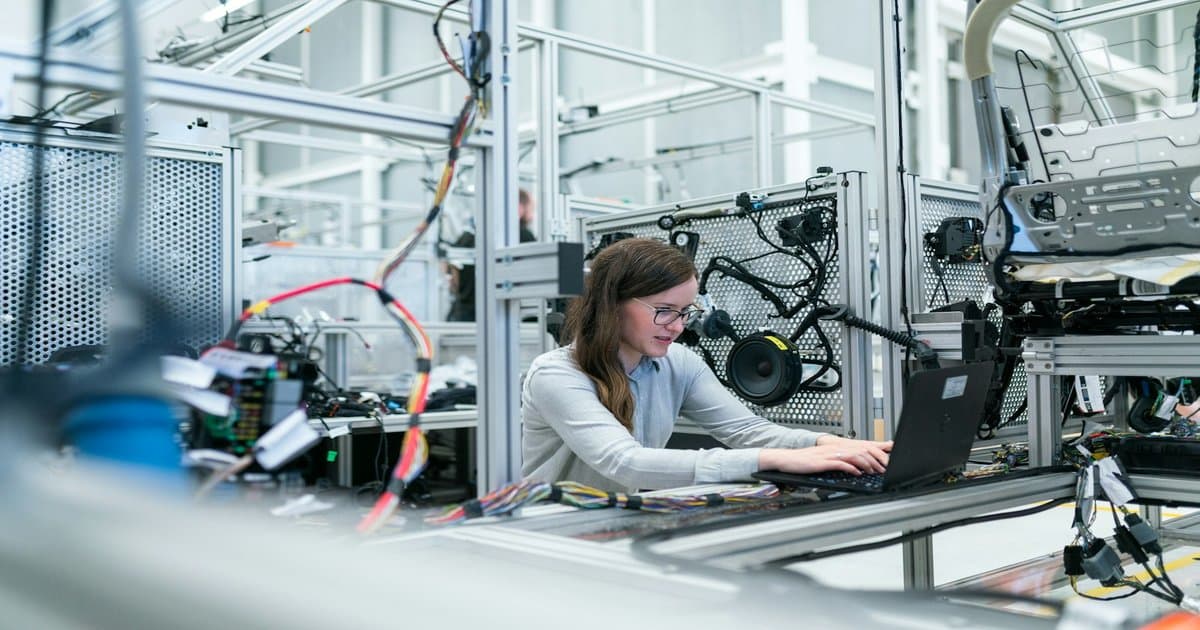 Specialist engineer at a workbench, illustrating vertical AI agents built for one job