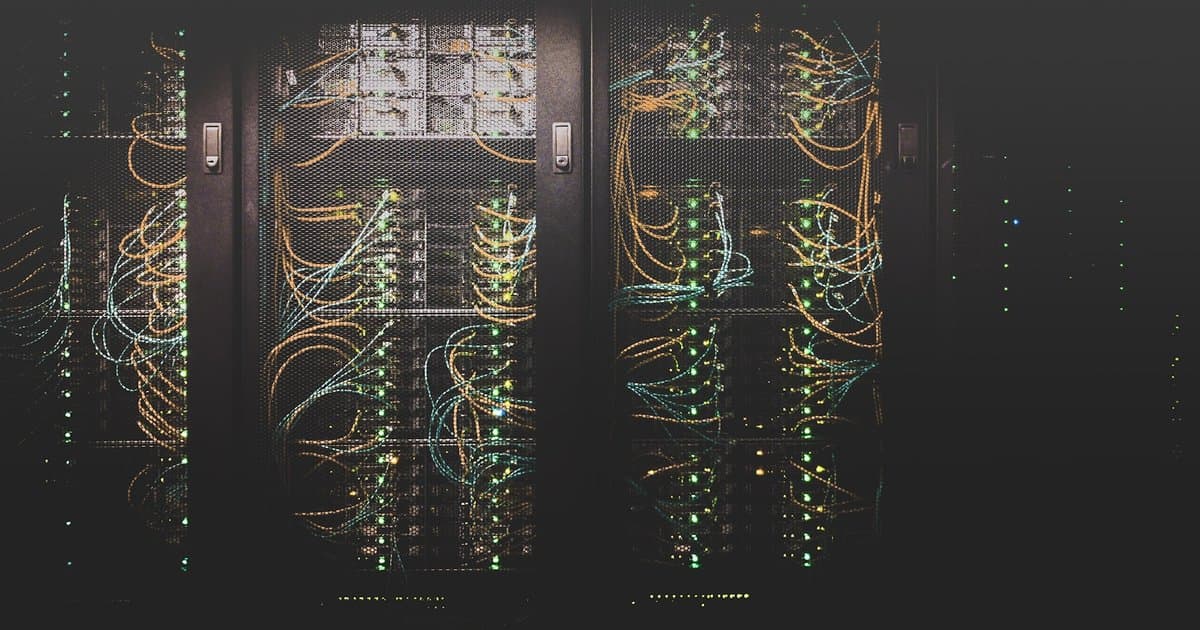 A network operations center with connected screens, representing an agentic OS coordinating a fleet of AI agents